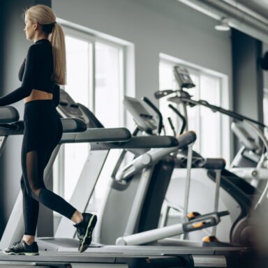 sporty-woman-running-treadmill-gym